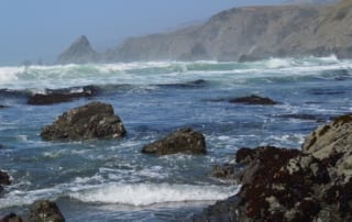 Ocean waves approaching rocky California shore