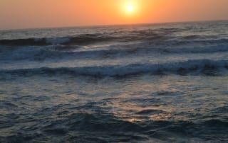 Sunset over ocean waves