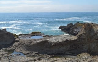 Outcropping rocks on the ocean shoreline of California