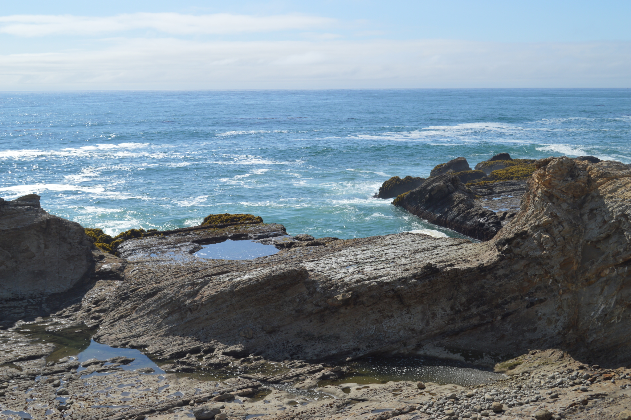 Outcropping rocks on the ocean shoreline of California